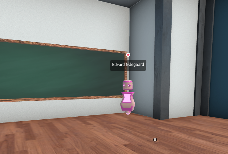 Pink robot avatar in a classroom